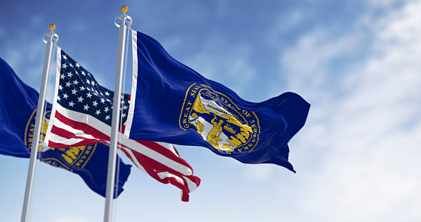 istock Nebraska state flag waving with the American flag 2215084853