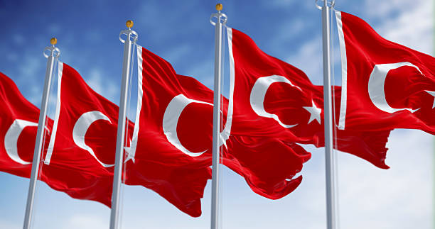 istock Turkish national flags waving in the wind on a clear day 2215084899