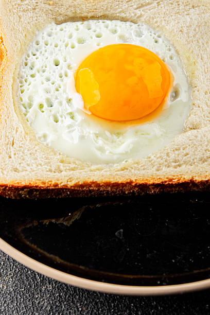 istock Fried gashouse eggs in bread egg in the basket delicious snack breakfast in a bowl fresh delicious gourmet food background on the table rustic food top view copy space 2215085849