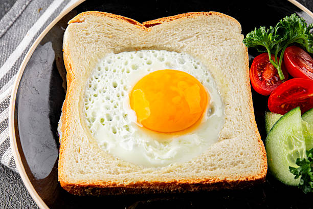 istock Fried gashouse eggs in bread egg in the basket delicious snack breakfast in a bowl fresh delicious gourmet food background on the table rustic food top view copy space 2215085853