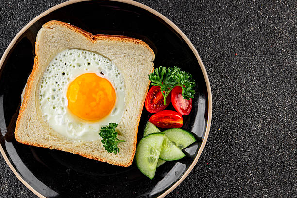 istock Fried gashouse eggs in bread egg in the basket delicious snack breakfast in a bowl fresh delicious gourmet food background on the table rustic food top view copy space 2215085884