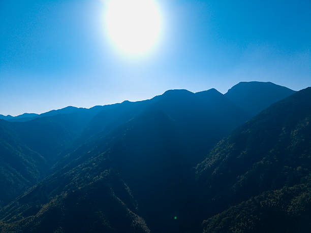 Mountainous Landscape with Dense Forests and Valley View