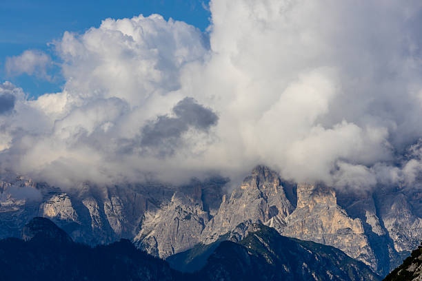 istock Above the clouds Dolomites rocky peaks. Towering cliffs above the clouds 2215091391