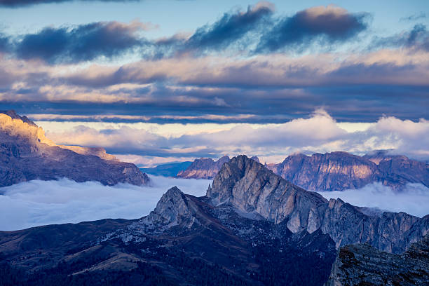 istock Above the clouds Dolomites rocky peaks. Towering cliffs above the clouds 2215091783