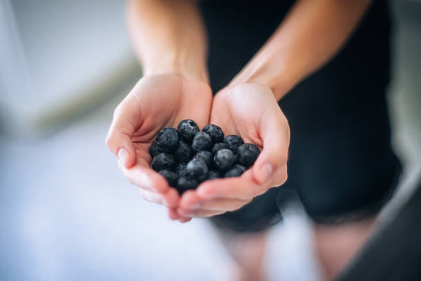 istock Hands Holding Fresh Blueberries Outdoors 2215093191