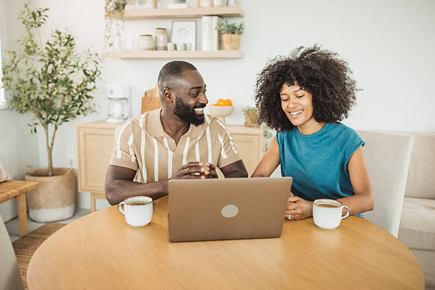 istock Lovely couple using laptop for online shopping 2215093440