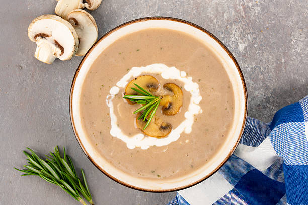 istock Delicious and healthy mushroom soup on stone background 2215095821