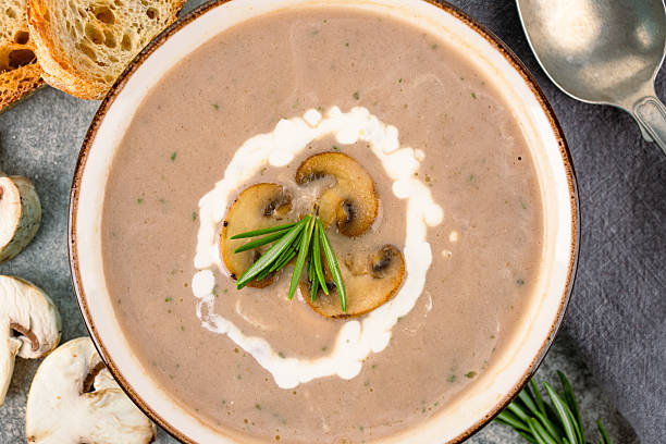istock Delicious and healthy mushroom soup on stone background 2215095908