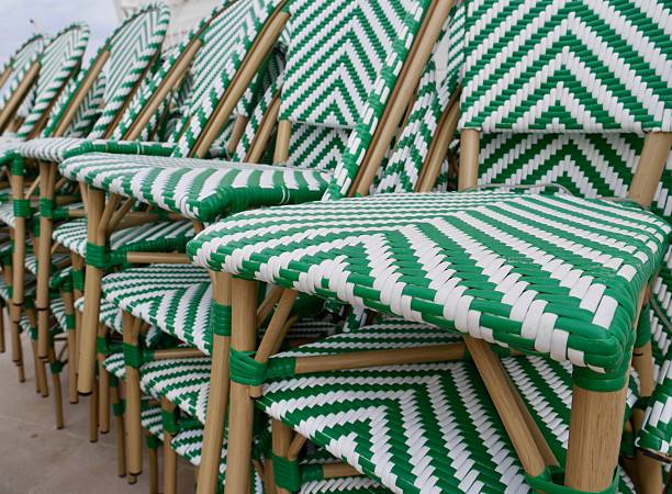istock Stacked white-green outdoor pub garden chairs. 2215096178