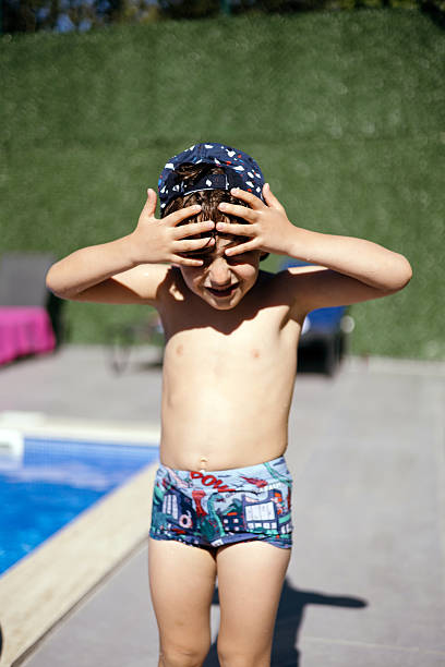 Child boy having fun at swimming pool,