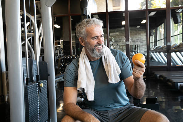 istock Bearded Middle-Aged Man Exercising in Gym – Strength and Wellness 2215100932