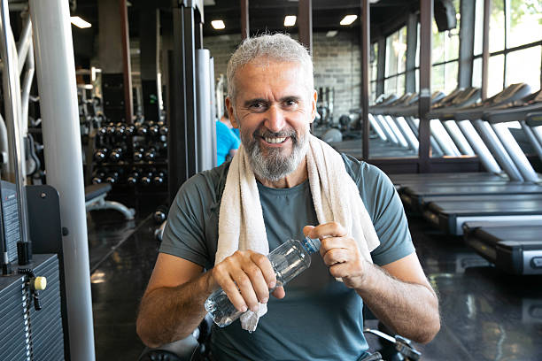 istock Strong Older Man Lifting Weights – Fitness and Longevity Concept 2215100958