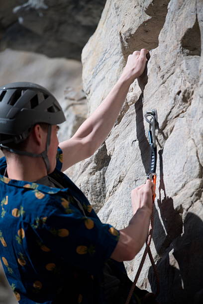 istock Male climber on rock face 2215107712