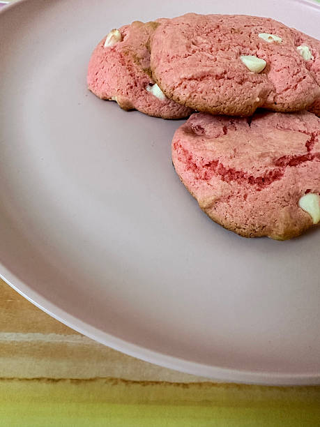istock Delicious strawberry white chocolate chip cookies on pink plate 2215109749