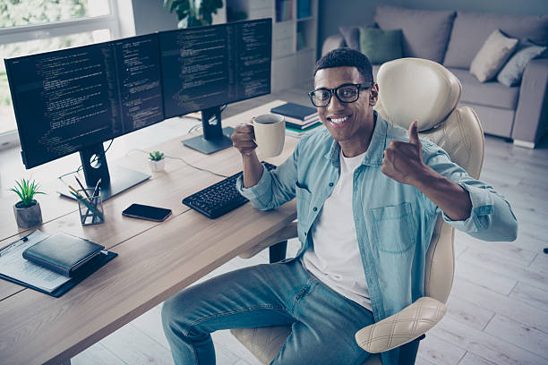 istock Photo of expert web software apps developer thumb up like gesturing having coffee break improving project features indoors office workplace 2215110907