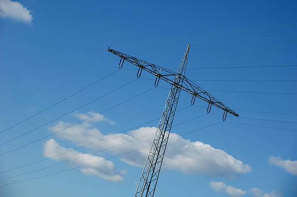 istock High Voltage Power Lines Against Clear Blue Sky 2215112646