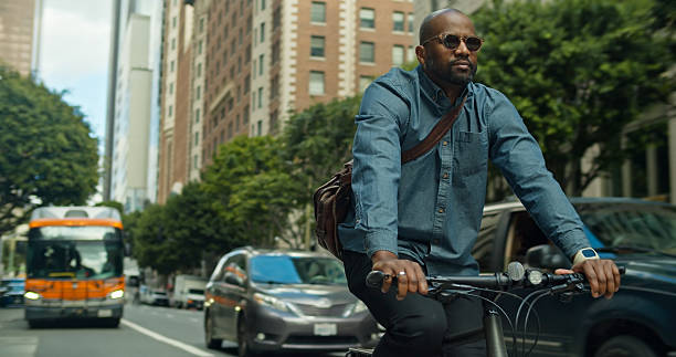 istock Los Angeles Bicycle Messenger Biking Next to Downtown Traffic 2215113909