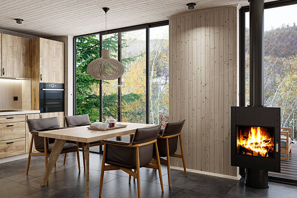 istock Scandinavian Kitchen Interior with Oak Cabinets and Freestanding Modern Fireplace 2215117051
