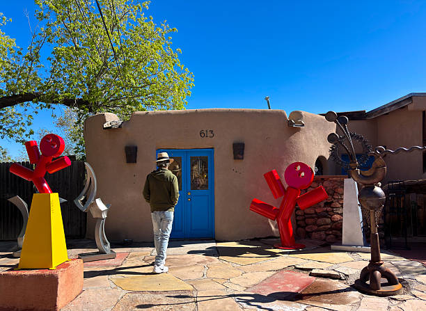 A man in a cowboy outfit with his horse