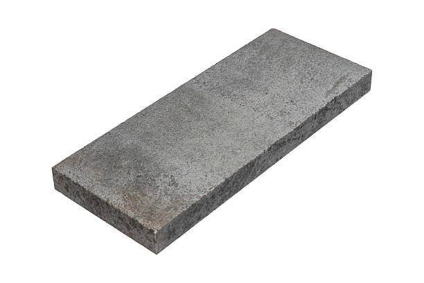 istock Light gray rough stone slab with visible grain is isolated. 2215120378