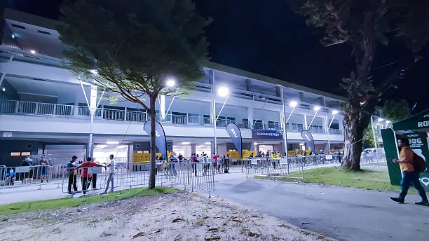 istock Brightly lit auto racing pit building in Singapore 2215121278