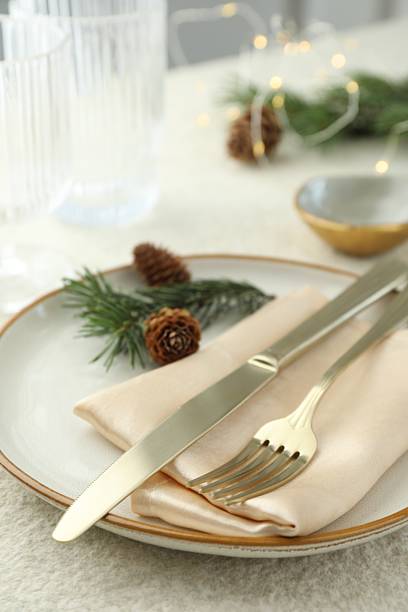 istock Christmas table setting with plate, cutlery, fir branches and cones, closeup 2215128045