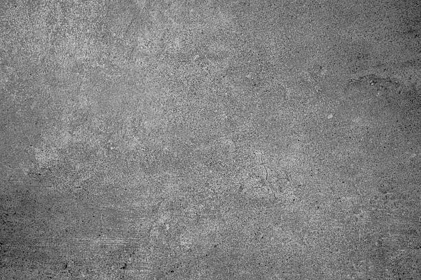 istock Gray concrete wall texture with natural surface imperfections and subtle cracks 2215132431