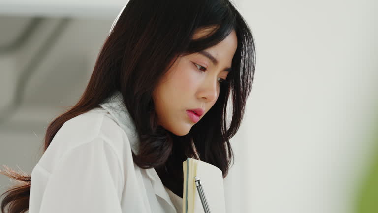 Focused young interior designer working with determination and creative ideas during home renovation project indoors