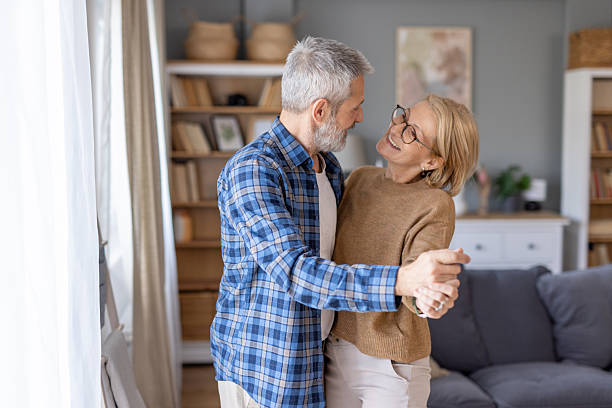 istock Couple enjoying a dance while sharing a loving gaze together. 2215139979