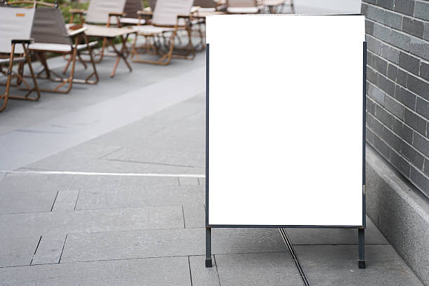 istock Blank white outdoor advertising stand or sandwich board mock up template. 2215147345