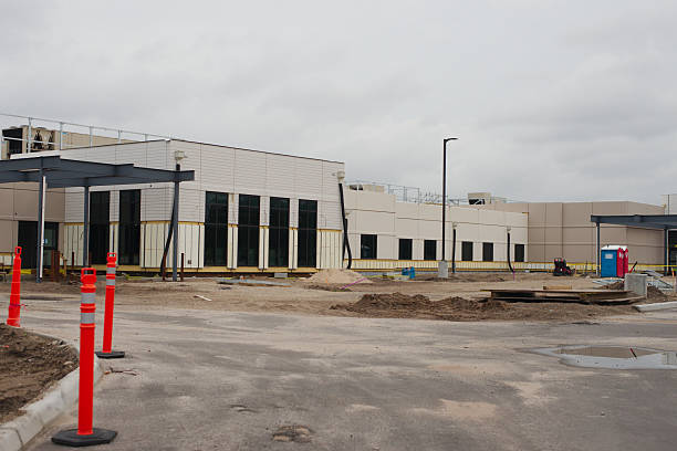 istock Modern Construction Site of a Commercial Building Under Development on Cloudy Day 2215149080