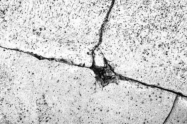 cracked stone wall surface with concrete closeup