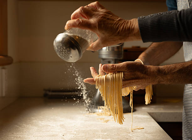 istock Preparing fresh homemade pasta in the kitchen 2215157173