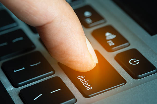 istock Finger of the computer user, he presses the delete button on the computer keyboard. 2215158251