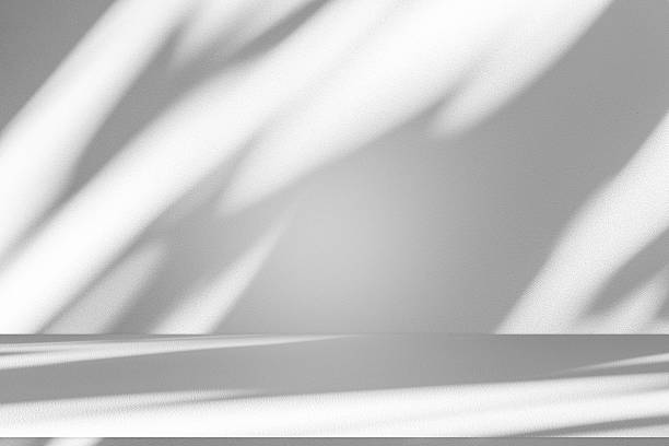 istock Wall interior background, studio and backdrops show products.with shadow from window color white . background for text insertion and presentation product 2215158277