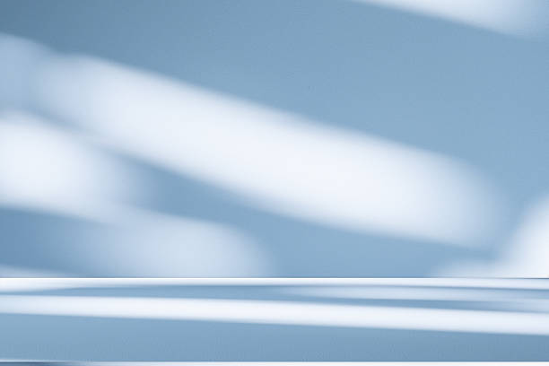 istock Studio style background wall decoration presentation uses white and blue tones. with shadows cast from a nearby window, concept creating a decorative 2215158298
