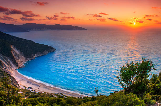 istock Beautiful summer sunset on Mirtos beach in Greece 2215159897