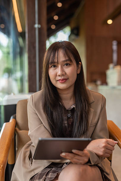 istock young woman with tablet computer in cafe 2215160991