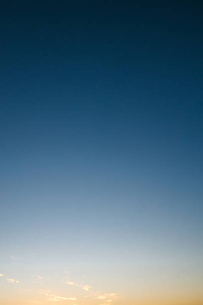 istock Clear gradient sky during sunset with soft golden and blue tones, minimal clouds and peaceful open atmosphere in nature 2215162559