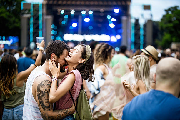 istock Embraced couple having fun on music concert. 2215168978