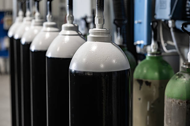 istock Freshly Painted Gas Cylinders Hanging in Production Line 2215169526