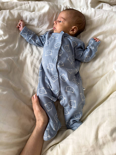 istock Baby in Blue Onesie with Bear Pattern 2215169667