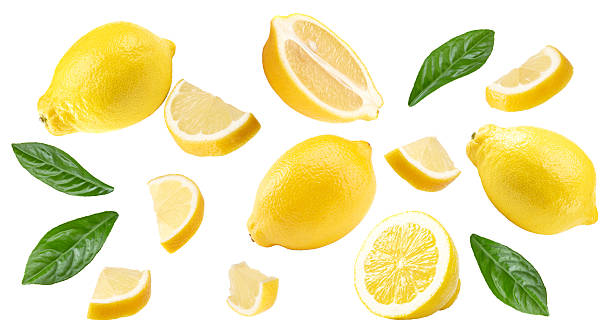 istock sliced lemon with leaves isolated on white background. clipping path 2215170520