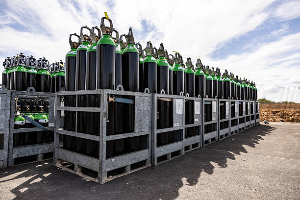 istock Compressed Gas Cylinders Stored Outdoors in Metal Crates 2215172085