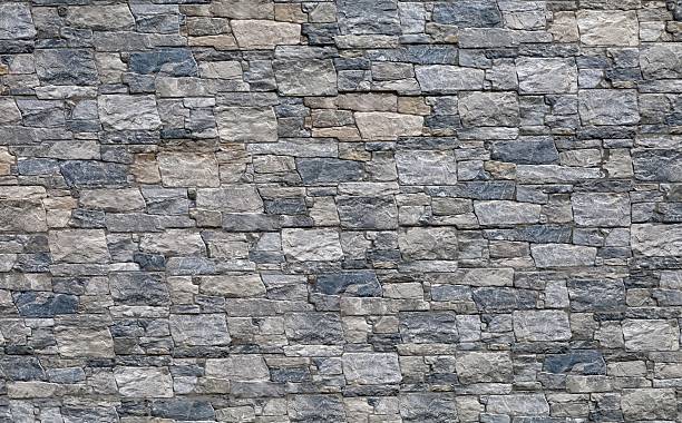 istock Stoneware paneling wall with old stonewall effect. Colors are gray, black, brown and white. 2215173151