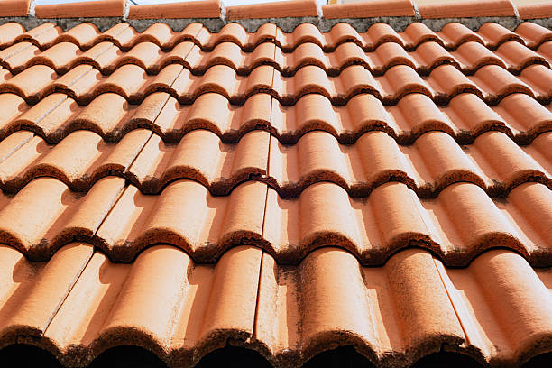 istock Terracotta roof with textured ceramic tiles in sunlight. Texture, background 2215173189