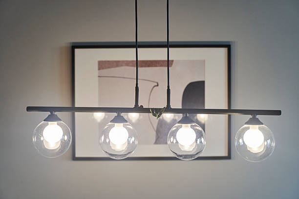 istock A Modern Pendant Light, Designed Stylishly with Framed Art, Enhances a Contemporary Space 2215173348