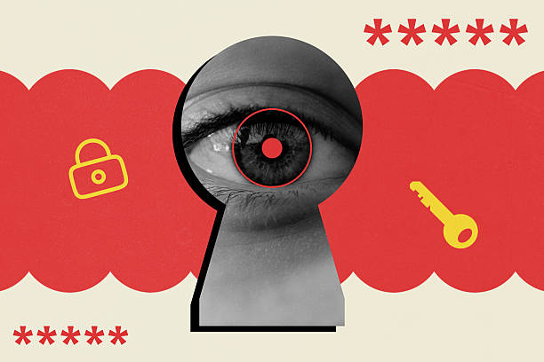 istock Eye looking through keyhole with a lock, key, and password symbols 2215176755