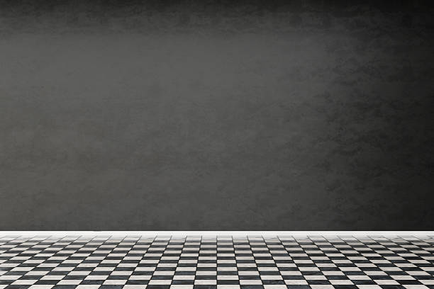 istock Spacious room features a checkerboard floor and a dark gray wall, providing a blank canvas for future design elements and furniture arrangement to create a personalized space 2215177077