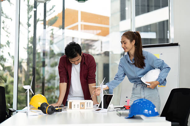 istock Engineer Collaboration on Sustainable Project. Team discussing renewable energy models in modern office. 2215177263